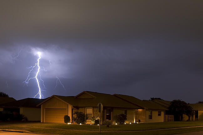 Lighting strike over home causing a neighborhood power outage