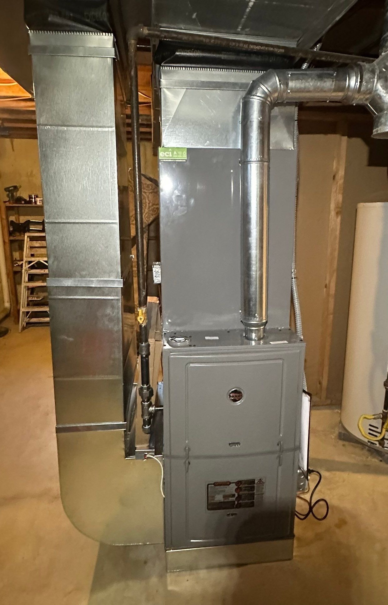 New Ruud furnace installed in the basement as part of the home’s heating and cooling system replacement.