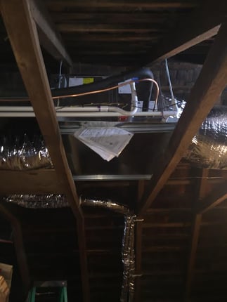 Unico High Velocity air handler mounted inside of an attic