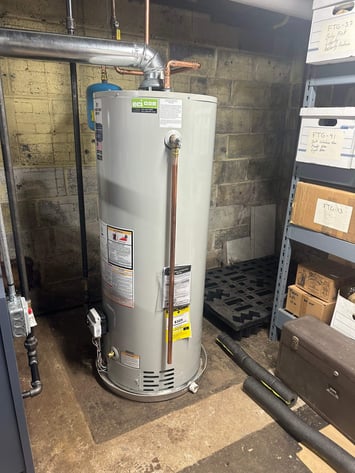 New gas water heater installed in the customer’s basement, replacing the previous electric water heater.