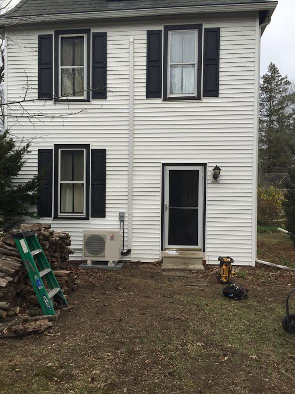 Heat pump installed in the back of an Edgewater Park, NJ home creates more of an out-of-sight look with its narrow and small features. 