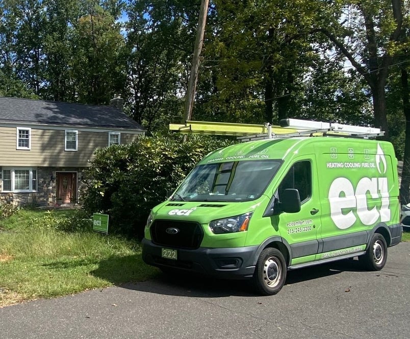 ECI Comfort truck parked outside a customer’s home during a gas steam boiler replacement and gas water heater conversion.