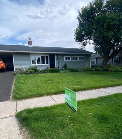 Customers home with lawn sign