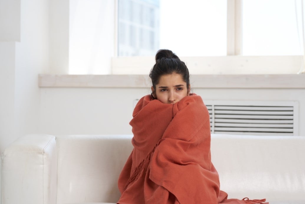 Woman cold in blanket due to heater Short Cycling 