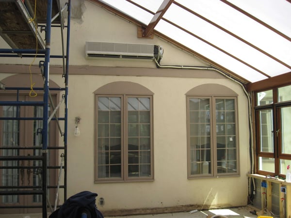 ECI Comfort installing an air handler in an all seasons room