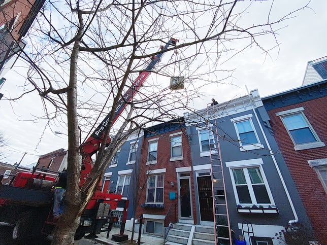 Crane loading AC On Row homes in Philadelphia, PA