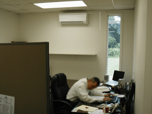 ECI installs a high wall ductless unit for a small office.