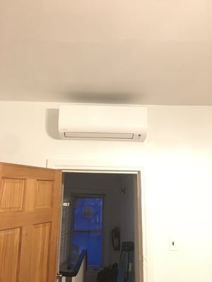 White Daikin indoor wall mounted ductless unit