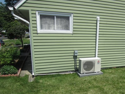 Ductless condenser outside Levittown home