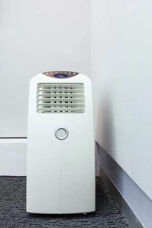 A space heater in the corner of a room is a temporary fix and does not have the strength of a central system.