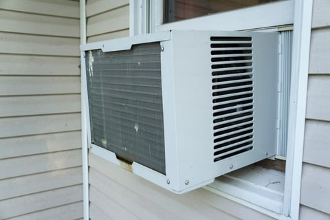 Air conditioning window units in Edgewater home before CI replaced them with Mitsubishi ductless vents.