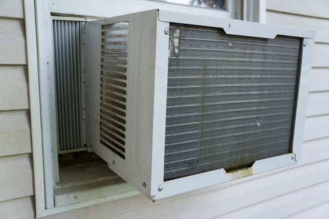 Old, inefficient window air conditioner in a Bensalem ranch home before ECI puts in a new system.