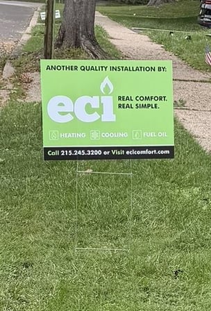  ECI Comfort yard sign outside a Langhorne, PA home following an oil-to-natural-gas conversion with a new Trane furnace.