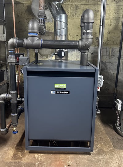 New gas-fired steam boiler installed in the customer’s basement, replacing an aging boiler and serving the home’s existing radiators.